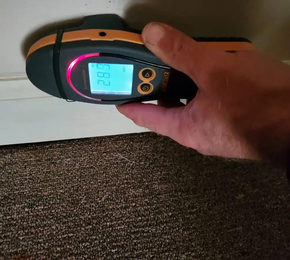 Moisture detection at baseboard during Sewage Cleanup & Sanitation in Ayer
